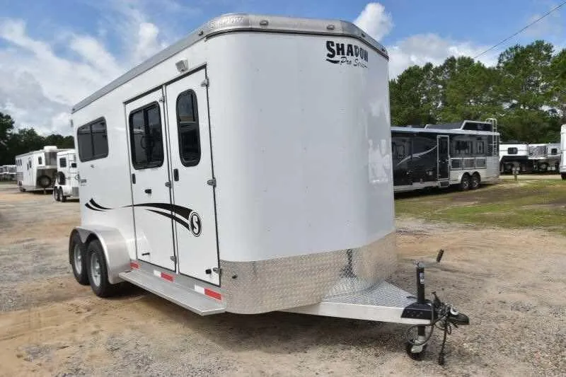 2016 Shadow 2STW-BP 2 horse bumper pull in white, front three-quarter exterior on a sandy dealer lot